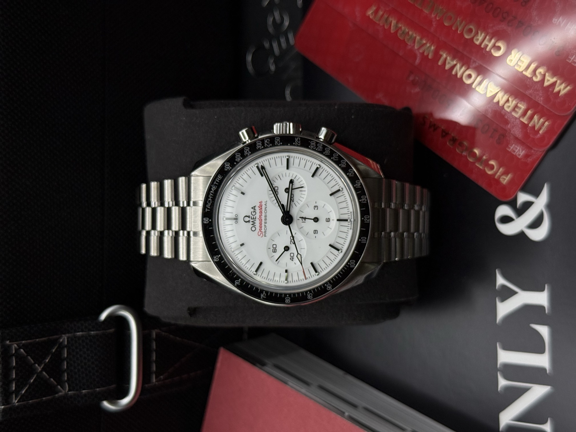 Retailer wearing a luxury watch in a professional setting
